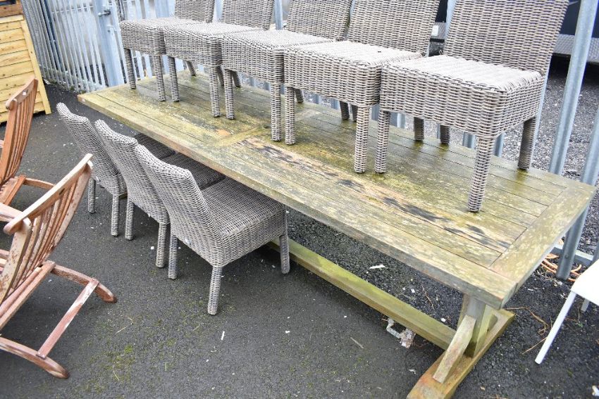 Large teak garden table sold at 1818 Auctioneers in the timed auction of furniture and furnishings